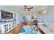 Spacious living room with modern decor, hardwood floors, and a view into the bright kitchen at 4900 Brittany S Dr # 1011, St Petersburg, FL 33715