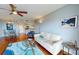 Comfortable living room features hardwood floors, ceiling fan, and a large white sofa at 4900 Brittany S Dr # 1011, St Petersburg, FL 33715