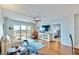 Cozy living room with a ceiling fan, sliders to a balcony, and views of the waterfront at 4900 Brittany S Dr # 1011, St Petersburg, FL 33715