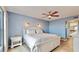 Tranquil bedroom featuring a ceiling fan, a full bed and a white nightstand at 4900 Brittany S Dr # 1011, St Petersburg, FL 33715