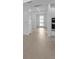 Neutral entryway showcases tile floors and an modern front door at 6982 Minneola Ct, Nokomis, FL 34275