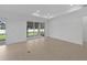 Spacious room with tile floors, recessed lighting, and access to the screened lanai at 6982 Minneola Ct, Nokomis, FL 34275