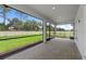 Screened patio with stone flooring, providing a bug-free space to enjoy the outdoors at 6982 Minneola Ct, Nokomis, FL 34275