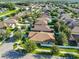 A high angle shot of homes featuring well-manicured lawns and mature shade trees at 12218 Avondale Oak Pl, Riverview, FL 33578