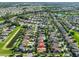 Aerial view of a neighborhood with lush landscaping, highlighting the property's position at 12218 Avondale Oak Pl, Riverview, FL 33578