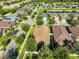 An eye-level shot shows suburban houses with green yards in a lakeside community at 12218 Avondale Oak Pl, Riverview, FL 33578