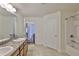 Bathroom featuring double sinks with granite countertops and tub-shower combination at 12218 Avondale Oak Pl, Riverview, FL 33578