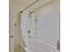 This tub-shower combination features tile surround and is stocked with toiletries at 12218 Avondale Oak Pl, Riverview, FL 33578