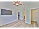 Bedroom featuring light walls and floors, and doorways to other rooms and closet at 12218 Avondale Oak Pl, Riverview, FL 33578