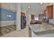 Modern kitchen featuring stainless steel appliances, granite countertops, and wood cabinets at 12218 Avondale Oak Pl, Riverview, FL 33578
