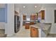 Well-appointed kitchen with stainless steel appliances and granite countertops, perfect for cooking at 12218 Avondale Oak Pl, Riverview, FL 33578
