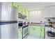 The spacious kitchen is updated with stainless steel appliances and a stainless steel sink at 1980 Tahitian Pl # 10, Dunedin, FL 34698