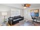 Bright living room featuring a comfortable sofa and modern decor at 1980 Tahitian Pl # 10, Dunedin, FL 34698