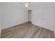 Bright bedroom featuring hardwood floors, ceiling fan, and a closet at 3964 Dream Oak Pl # 203, Tampa, FL 33613