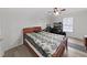 Bedroom with ceiling fan, natural light, and hardwood floors at 3964 Dream Oak Pl # 203, Tampa, FL 33613
