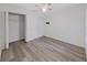 Bright bedroom featuring hardwood floors, ceiling fan, and a closet at 3964 Dream Oak Pl # 203, Tampa, FL 33613
