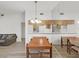 Dining room featuring a wooden table, open to living area and kitchen at 3964 Dream Oak Pl # 203, Tampa, FL 33613