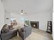 Bright living room with a fireplace, ceiling fan, and open concept dining area at 3964 Dream Oak Pl # 203, Tampa, FL 33613