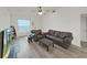 Living room with a ceiling fan, fireplace and laminate flooring at 3964 Dream Oak Pl # 203, Tampa, FL 33613