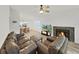 Bright living room with a fireplace, ceiling fan, and open concept dining area at 3964 Dream Oak Pl # 203, Tampa, FL 33613