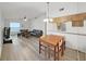 Spacious living room with dining area, hardwood floors and natural light at 3964 Dream Oak Pl # 203, Tampa, FL 33613