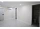 Clean basement space with marble floors and multiple entryways and a bathroom at 4720 Murray Hill Dr, Tampa, FL 33615