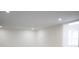 Bright room featuring modern recessed lighting and a large window at 4720 Murray Hill Dr, Tampa, FL 33615