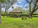 Neighborhood gazebo with picnic seating, offering a relaxing outdoor gathering spot at 5110 Lake Valencia E Blvd, Palm Harbor, FL 34684