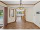 Dining area with views to a modern kitchen and an outdoor pool at 5110 Lake Valencia E Blvd, Palm Harbor, FL 34684
