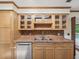 Kitchen area featuring tile countertops, wooden cabinets, and stainless steel appliances at 5110 Lake Valencia E Blvd, Palm Harbor, FL 34684