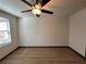 Bright bedroom with light-colored walls, ceiling fan and big window at 8819 Walnut Gable Ct, Riverview, FL 33578
