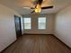 Bedroom with hardwood flooring and window with blinds at 8819 Walnut Gable Ct, Riverview, FL 33578