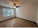 Bedroom with window, light colored walls and ceiling fan at 8819 Walnut Gable Ct, Riverview, FL 33578