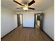 A cozy bedroom with great hardwood flooring at 8819 Walnut Gable Ct, Riverview, FL 33578