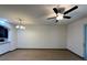 Open floorplan living area includes ceiling fan and laminate floors at 8819 Walnut Gable Ct, Riverview, FL 33578