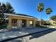 Community mailboxes under a shelter with manicured landscaping and ample parking at 8819 Walnut Gable Ct, Riverview, FL 33578