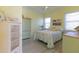 Bright bedroom with charming decor, light yellow walls, and plenty of natural light at 9016 Falcon Ct, Venice, FL 34293