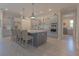 Spacious kitchen with stainless steel appliances, a large island, and ample cabinet space for storage at 9016 Falcon Ct, Venice, FL 34293
