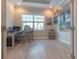 Office with hard wood flooring and a large window that allows ample natural light at 9016 Falcon Ct, Venice, FL 34293