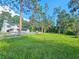 Large lot with a well-maintained fence surrounding a meticulously kept lawn at 10928 Echo Loop, New Port Richey, FL 34654