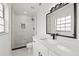 Bathroom features marble shower, black fixtures, and a modern vanity at 4410 Lurline Cir, Tampa, FL 33610