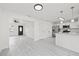 Open concept living space features updated kitchen with stainless steel appliances at 4410 Lurline Cir, Tampa, FL 33610