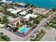 Aerial of motel with pool, parking, and waterfront location at 64 Bay Esplanade # 302, Clearwater, FL 33767
