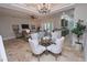 Open concept dining room with seating for four and kitchen views at 7814 Hidden Creek Loop # 104, Lakewood Ranch, FL 34202