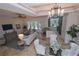 Spacious living room with access to the backyard and kitchen at 7814 Hidden Creek Loop # 104, Lakewood Ranch, FL 34202