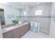 Elegant bathroom featuring double vanity, large shower, and modern fixtures at 7814 Hidden Creek Loop # 104, Lakewood Ranch, FL 34202