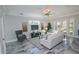 Bright living room showcasing comfortable seating, large windows, and stylish decor at 7814 Hidden Creek Loop # 104, Lakewood Ranch, FL 34202