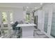 Modern kitchen with white cabinets and a breakfast bar at 7814 Hidden Creek Loop # 104, Lakewood Ranch, FL 34202
