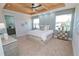 Main bedroom with wood ceiling and large bed at 7814 Hidden Creek Loop # 104, Lakewood Ranch, FL 34202