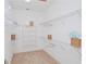 Large walk-in closet with ample shelving and hanging space at 7814 Hidden Creek Loop # 104, Lakewood Ranch, FL 34202